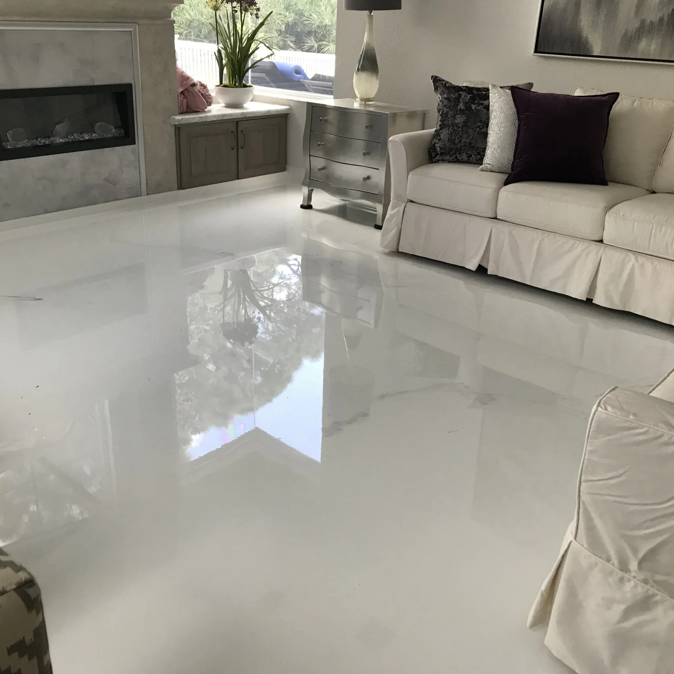 White residential epoxy floor in finished living space
